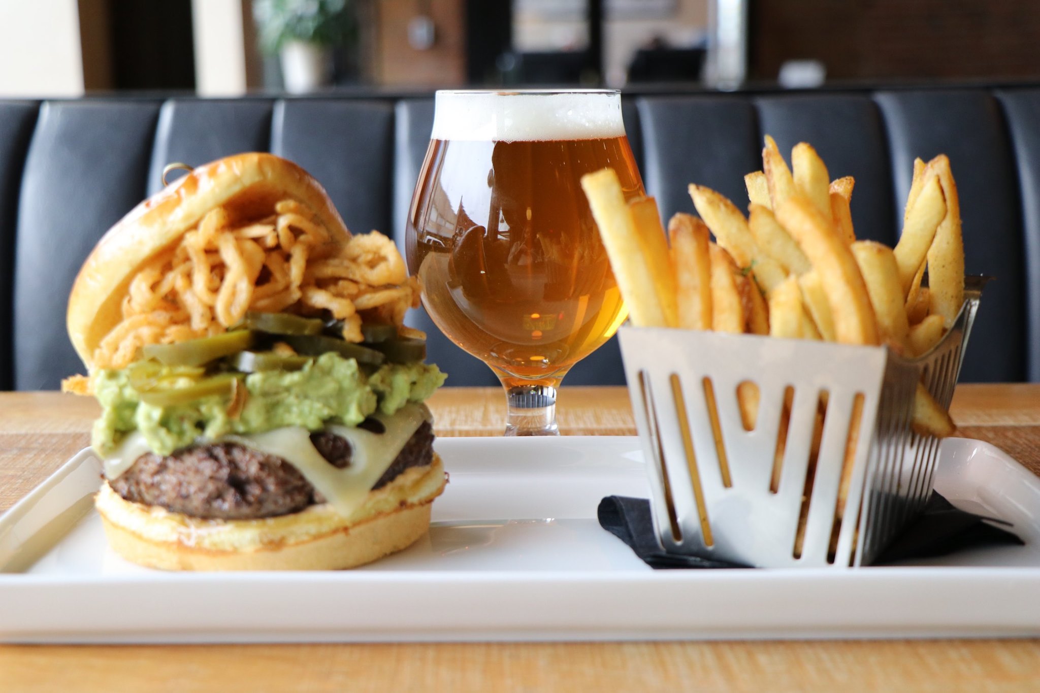 Lone Buffalo burger with a side or fries and a beer. 