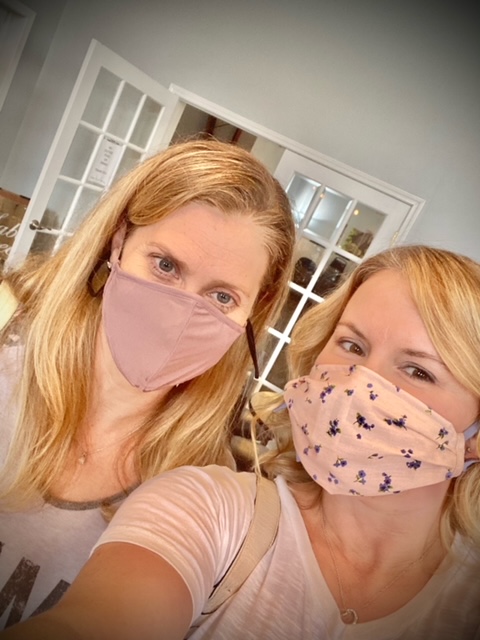 Nelie posing with her friend with mask on