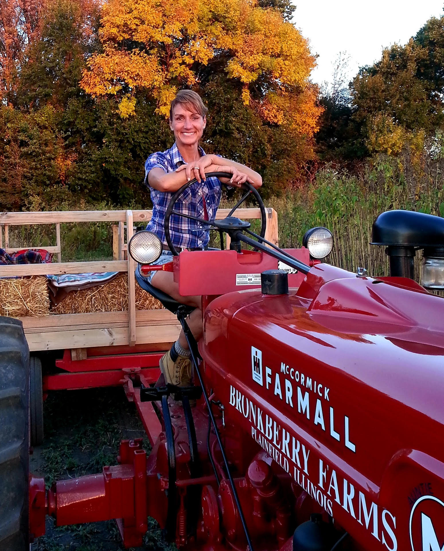 Jennifer Bronk sitting on top of a tractor