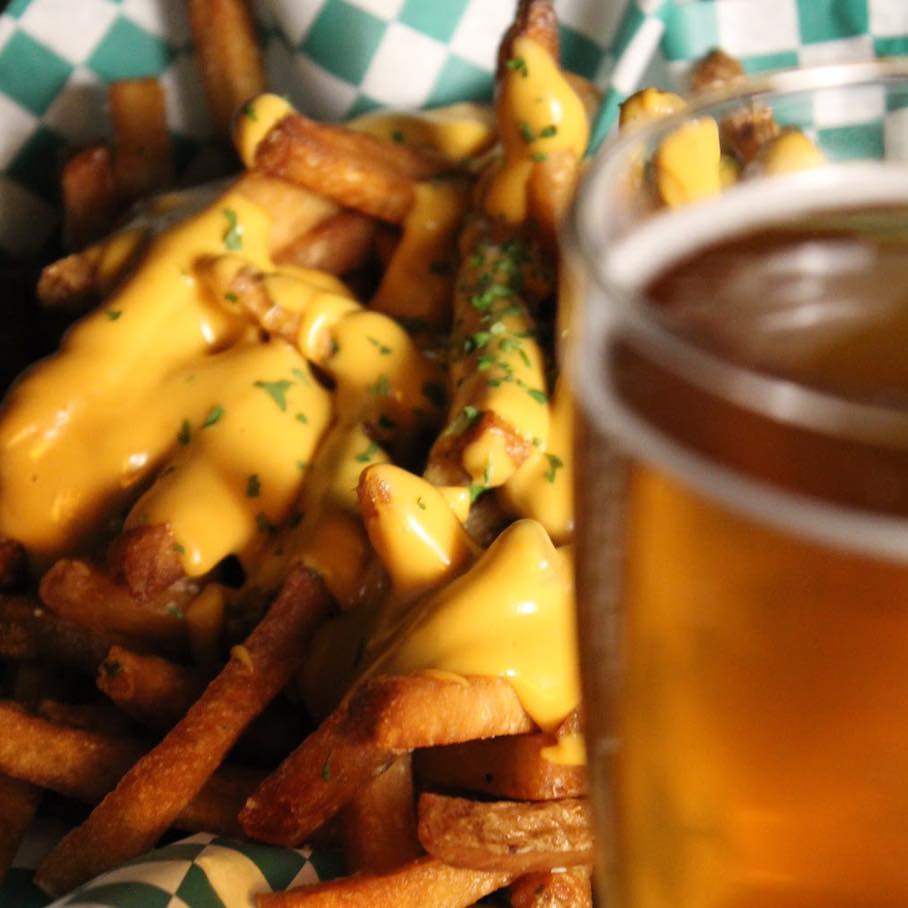 migraine brewing cheese fries with a beer