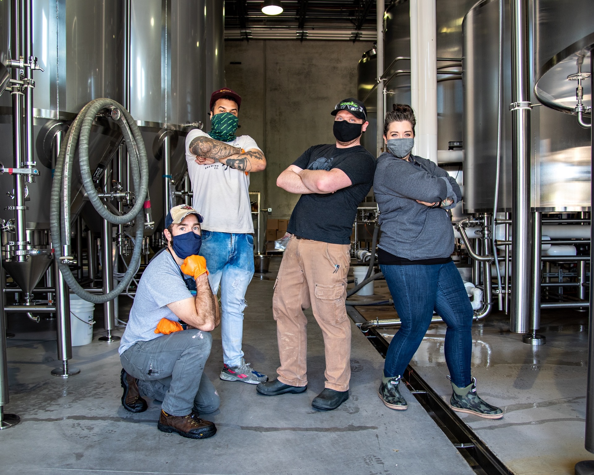 Brewers posing for photo after brewing
