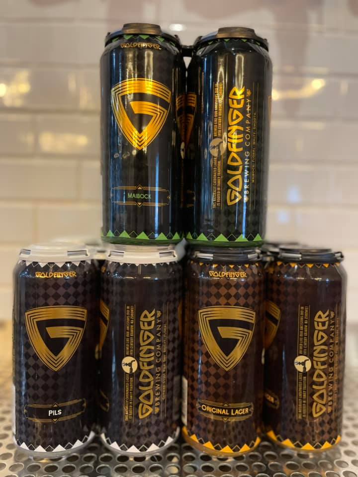 Six cans of Goldfinger Brewing Company's Maibock