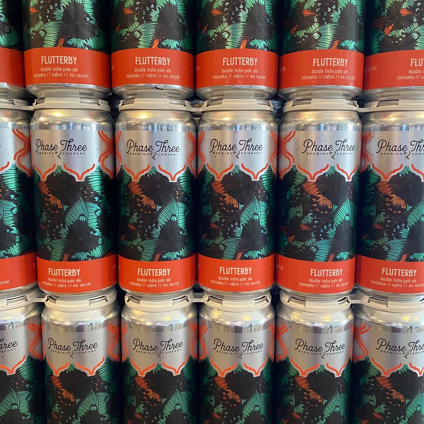 Stacks of cans from Phase Three Brewing