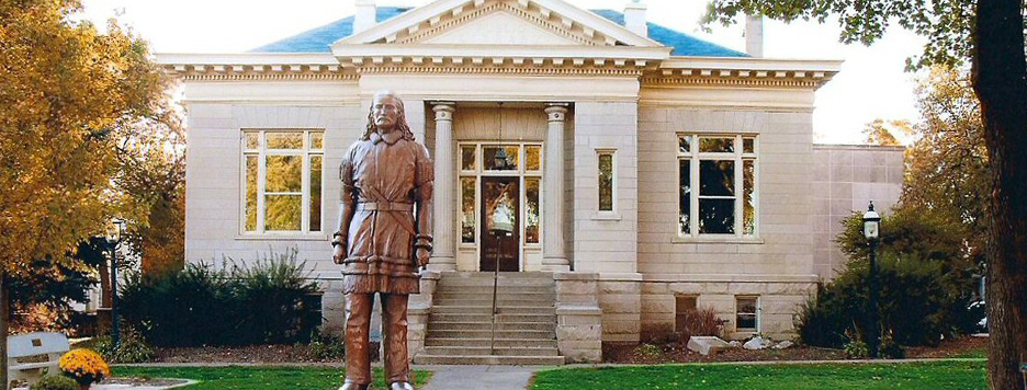 exterior shot of the Mendota museum with the statue of wild bill