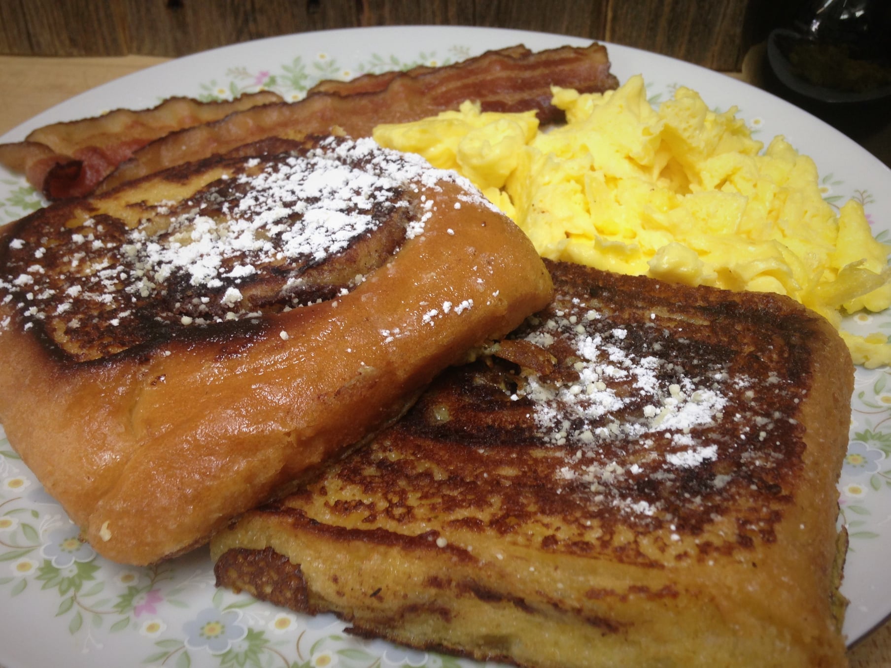 French toast, bacon and scramble eggs on a plate