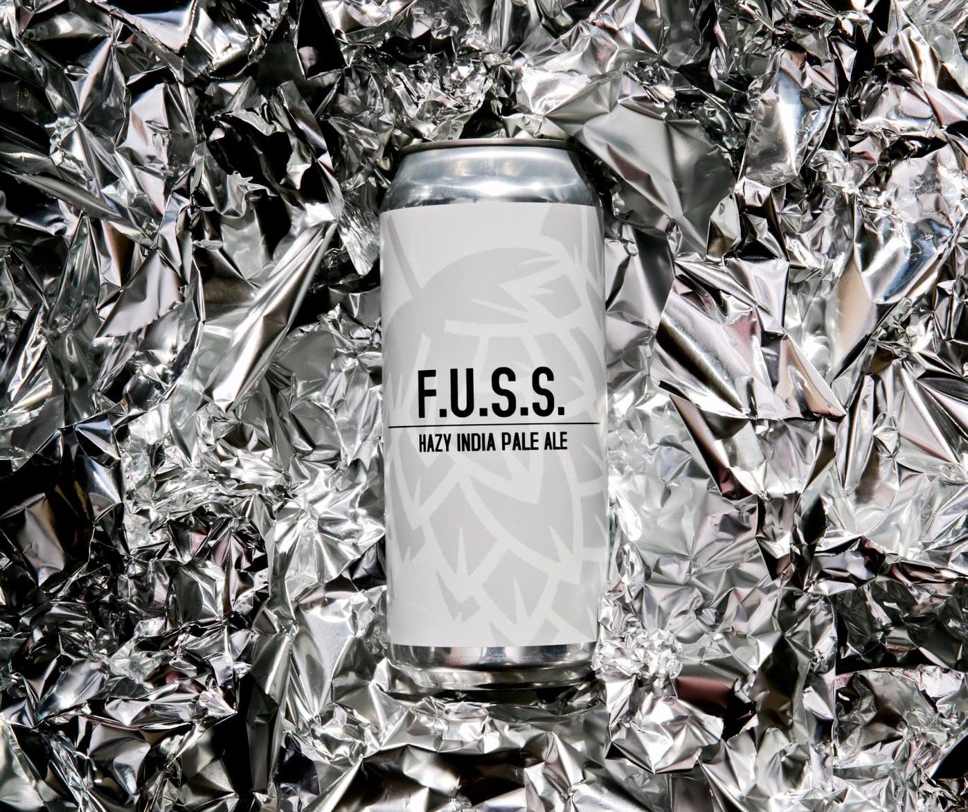 Can of Fuss, with a background of crinkled tin foil