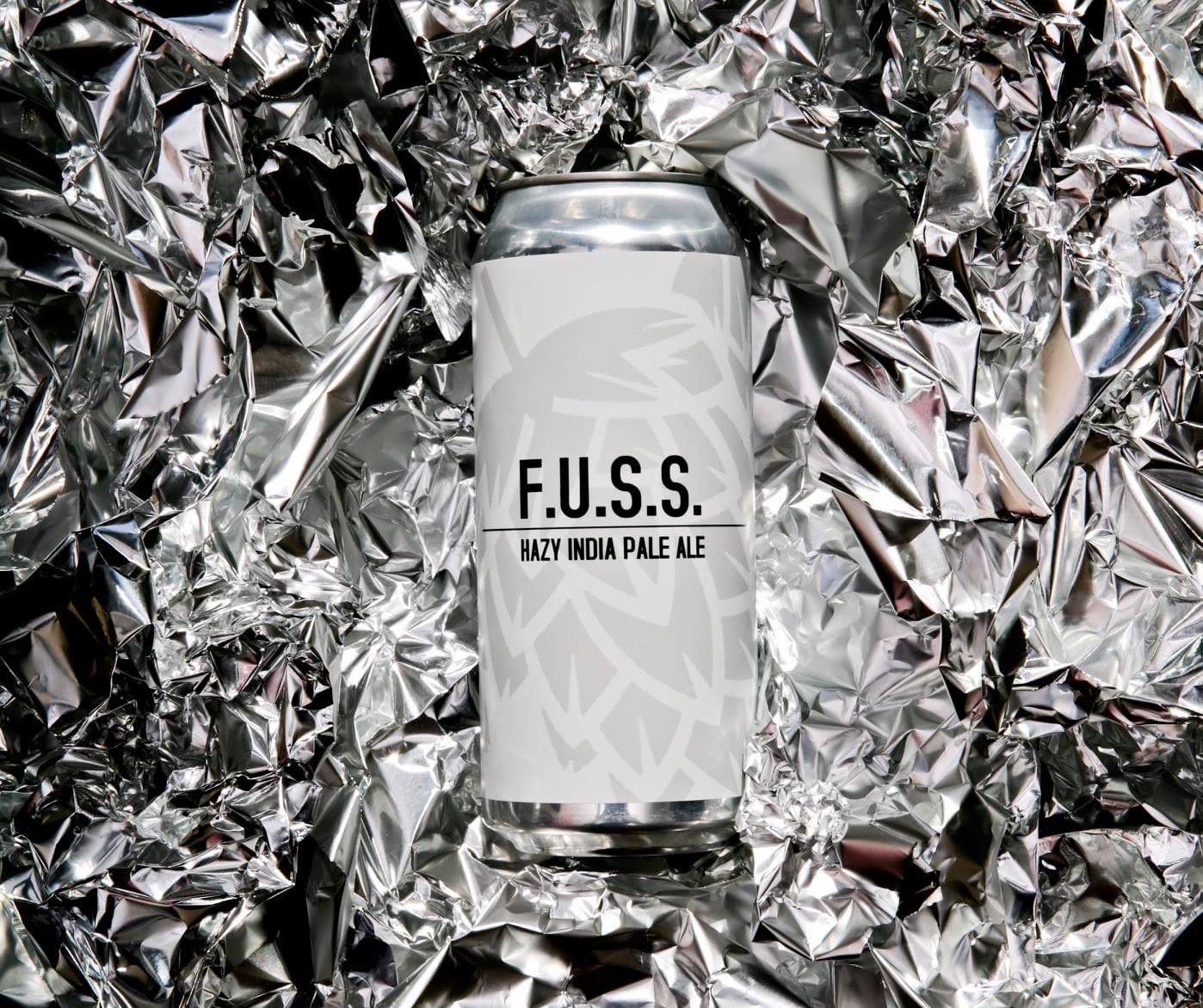 Can of Fuss, with a background of crinkled tin foil