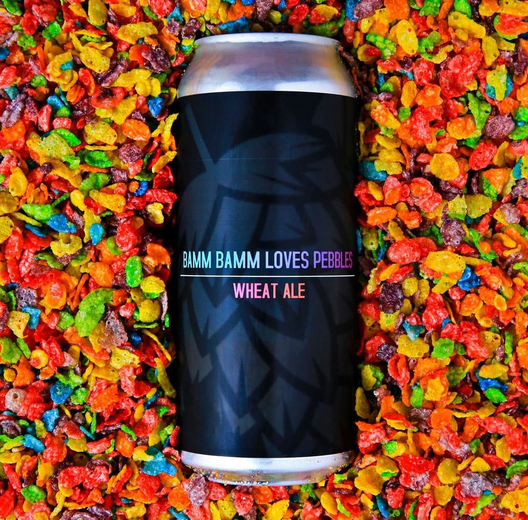 Can of Bamm Bamm Loves Pebbles, surrounded by fruit flavored cereal