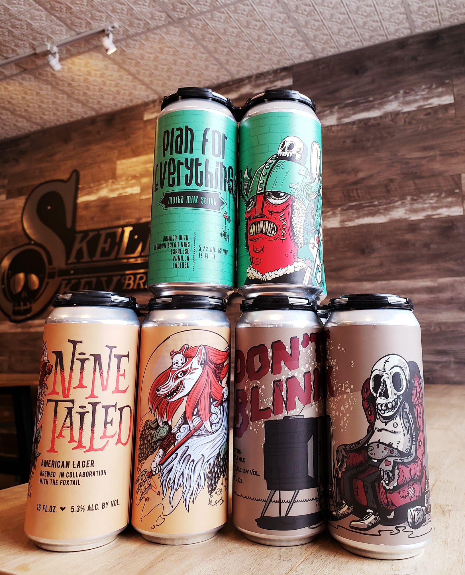 Three four packs of beer from Skeleton Key Brewery