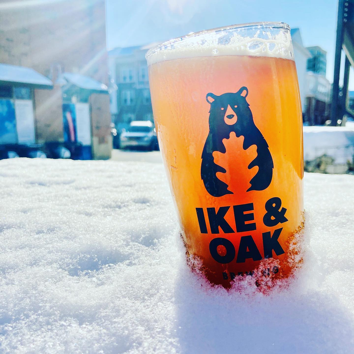 Glass of beer in snow at Ike & Oak Brewing