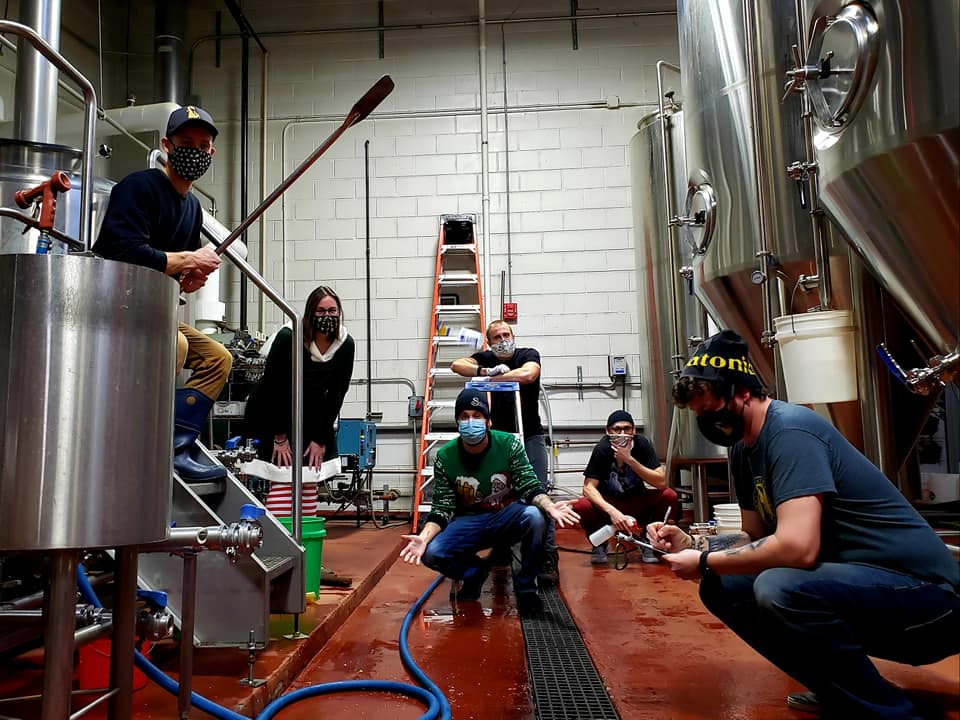 Miskatonic and Skeleton Key Brewers making a batch of beer