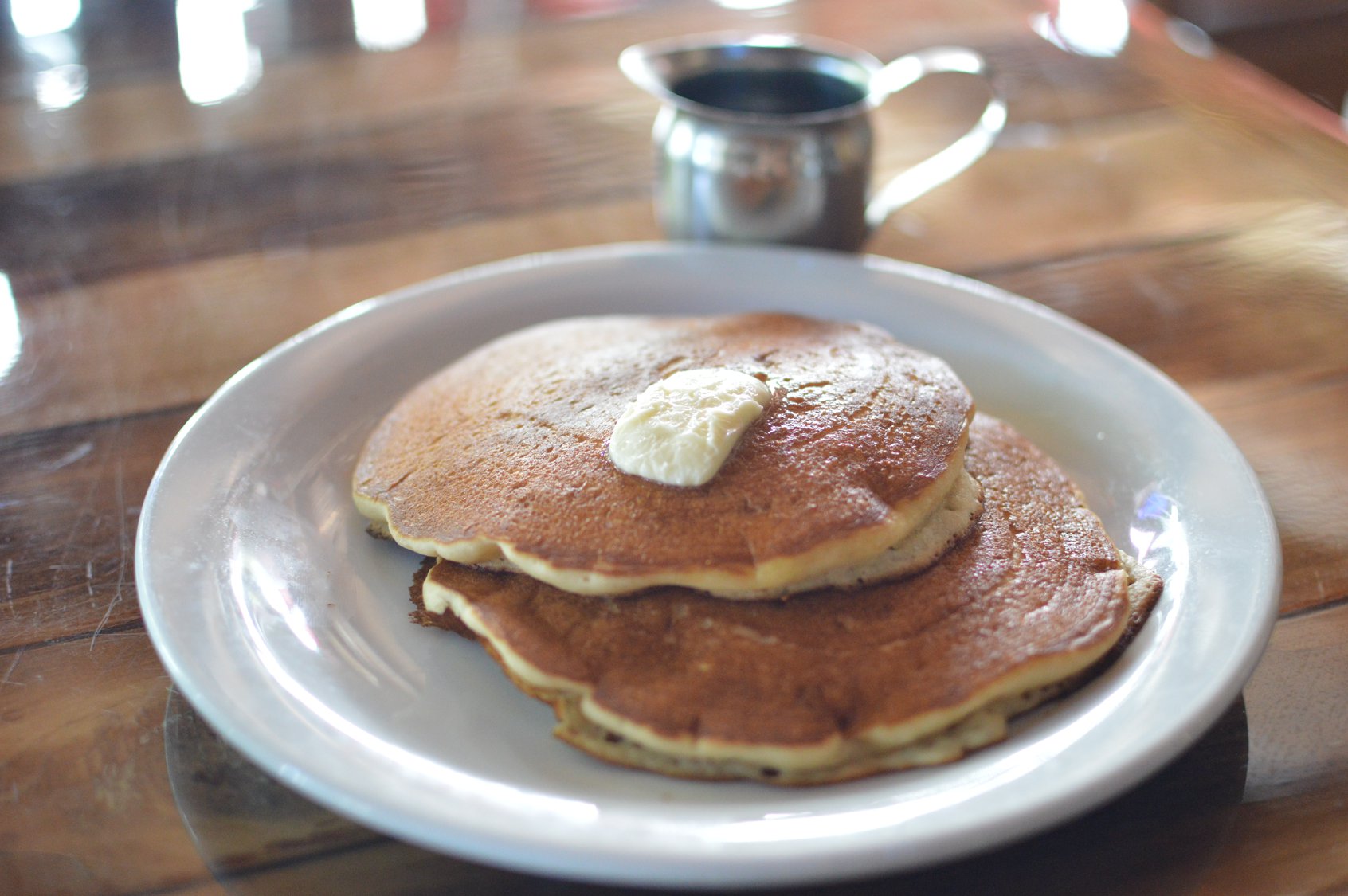 pancake breakfast with syrup and butter
